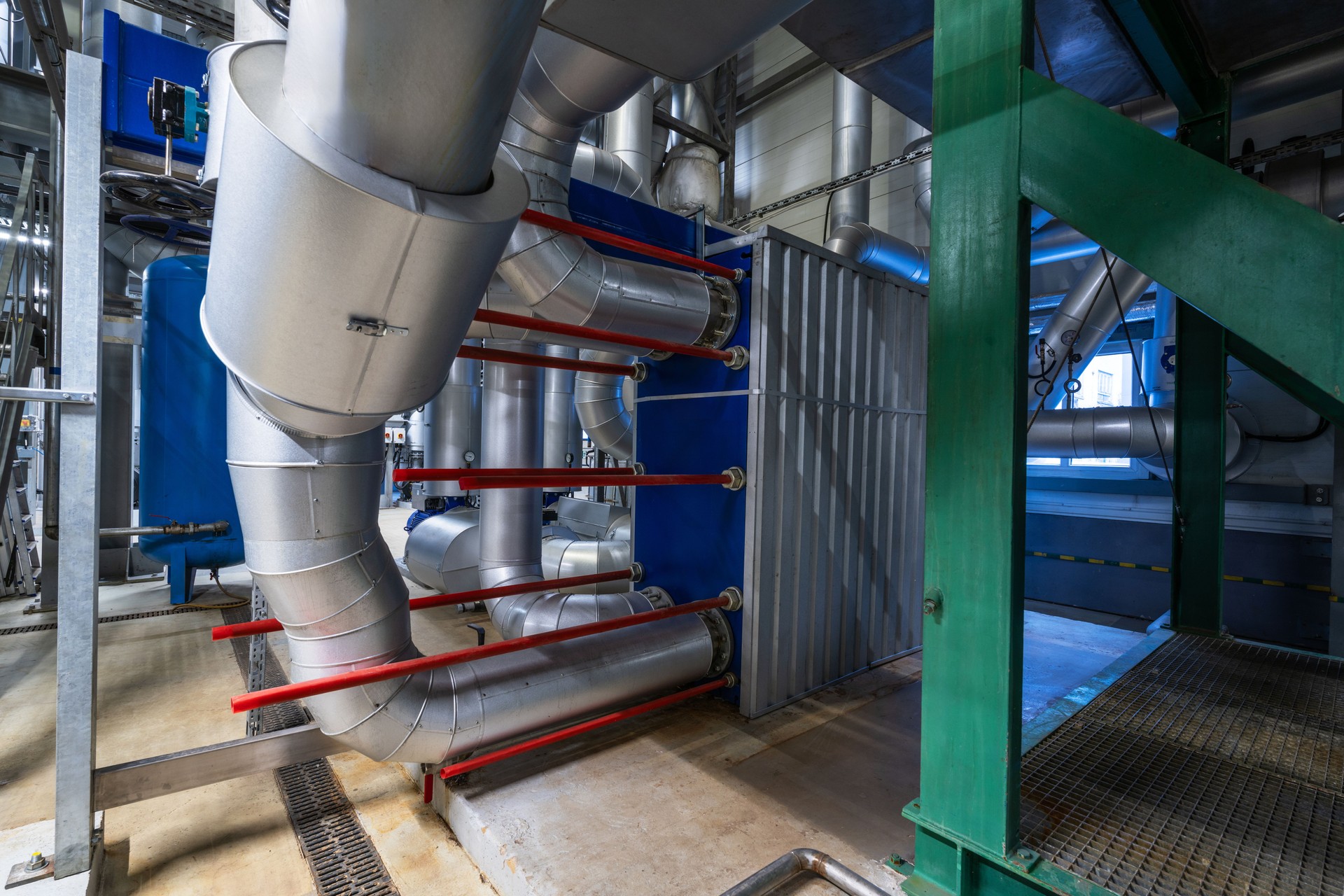 Equipment, cables and piping as found inside of a industrial power plant